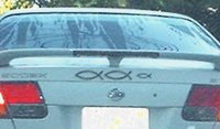 Some car with a lot of Jesus fish on it... must be extra holy or something