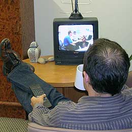 man watching his TV set
