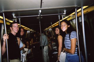 Girlyman still holding rail on Metro car