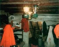 Cabin interior with gasoline lanterns 