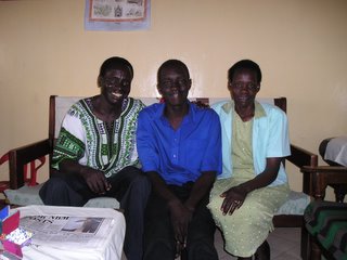 Stephen, Abraham and Grace Tomoro in their home.
