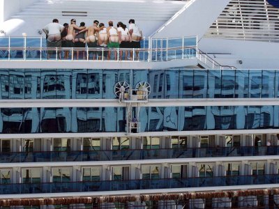 We kept our distance but this photo clearly shows, passengers onboard the Drop Anchor Cruise Ship are going overboard.
