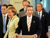 Angela Merkel, Koizumi, while Chirac and Bush in the background