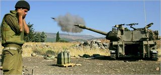 HELENE COOPER and STEVEN ERLANGER, NYT, An Israeli gunner covered his ears as an artillery piece fires towards targets in southern Lebanon from a position in northern Israel