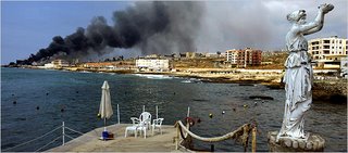 Jieh, South of Beirut, an emptied resort, a burning fuel depot after an Israeli air strike (NYT)