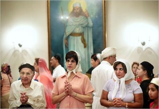 Zoroastrians gathered for an annual fire ceremony last month in Burr Ridge, Ill. A portrait of the Prophet Zarathustra is in the background (Sally Ryan for NY Times)