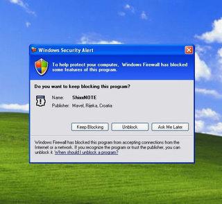 Windows Firewall dialog on Windows XP where you must click Unblock button to enable sending and receiving notes