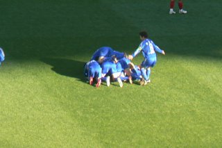 Suwon players celebrate Baek's goal
