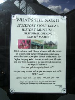 Poster in Staircase House window, with the Glass Umbrella in reflection