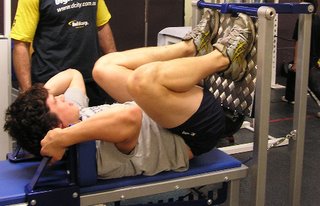 Tom Carter in the deeply flexed position on the HipneeThrust leg extensor strength machine