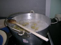 pan of gooseberry jam boiling up on the cooker top
