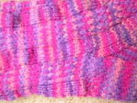close up of pinks and purples sock showing panels of stocking stitch and slip stitch