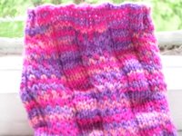 close up of pinks and purples sock showing panels of stocking stitch and slip stitch
