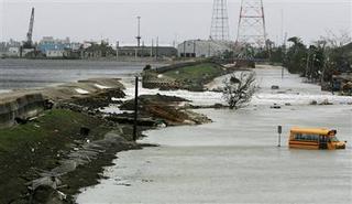 New Orleans levee breached as outer bands of Hurricane Rita hit vicinity. Water flows through a breach in the repaired Inner Harbor Canal toward the Ninth Ward District Friday in New Orleans. Justin Sullivan / Getty Images