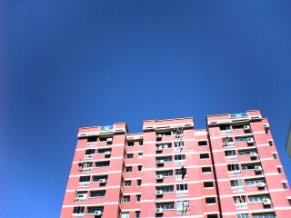 Blue Sky  Tampines Block with clothes hung-up to dry