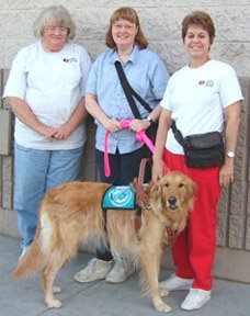 photo of testers Nancy and Kathe with me, and a blue certified cape over Sophie's back