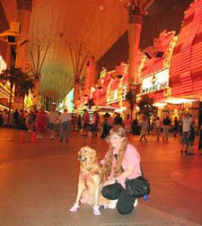 photo of Sophie and me on Fremont Street in Las Vegas, with light of hotels and neon signs in the background