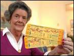 Catherine Price, 83, of Vicksburg, holds two unused 1956 World Series tickets to the game in which Don Larsen pitched the only perfect game in World Series history. She and her husband used two box seat tickets to attend the game, saving the unused pair.