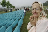 Bosnian Muslim women Hasiba Hadzic reacts as she finds name of her relative at the among 505 bodies to be buried during funeral ceremony at the Memorial Center Potocari, near Srebrenica north of Bosnian capital Sarajevo, Tuesday, July 11, 2006. The bodies will be buried marking the 11th anniversary commemorations of the massacre. Serb troops killed over 8,000 Muslim men and boys at Srebrenica in 1995.(AP Photo/Amel Emric)