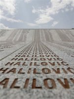 A column containing the last name of Halilovic, one name among the many missing persons, are etched into the marble along with 8,370 names of Srebrenica victims, at the Memorial Center Potocari, near Srebrenica north of Bosnian capital Sarajevo, on Sunday, July 9, 2006. Newly identified bodies will be buried in Srebrenica on Tuesday (July 11th) during the 11th anniversary commemorations of the massacre. Serb troops killed over 8,000 Bosniak men and boys at Srebrenica in 1995, and most of the bodies are still missing. (AP Photo/Amel Emric)