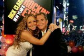 Here's a picture of Mariah Carey squeezing our Dick on New Year's Eve.