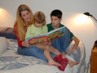 Linda reading to Felicity and Elon, the two youngest of six brothers and sisters in Phil and Linda's family