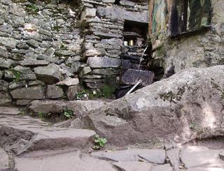 shrine with notes stuffed in crevices