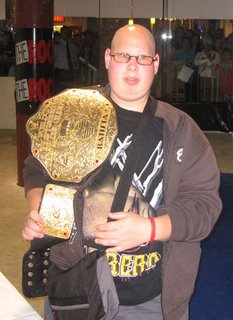 Damian wearing Batista's World Wrestling Heavyweight Championship Belt