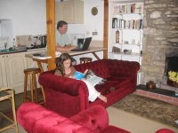 Mark in the kitchen and Emily in the sitting room
