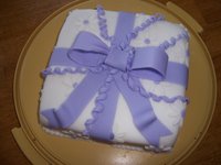 present cake with large ribbon
