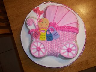 pink cake with baby in stroller