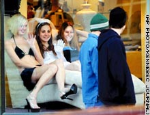 cute lingerie models in store window