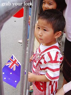 Chinese New Year parade Sydney 2006 boy with an Australian flag