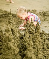Girl playing on the beach