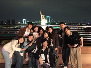 Taking photo with the statue of liberty and the rainbow bridge