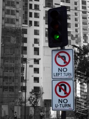 Traffic light and signs at Ayala Avenue and Buendia Avenue intersection
