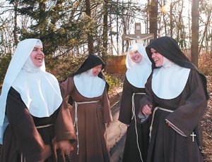 'Four Poor Clare nuns enjoy a lighthearted moment at the St. Clare Monastery in St. Louis in early January.... (CNS photo/Mark Kempf, St. Louis Review)'