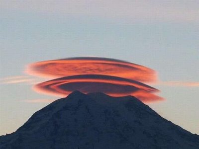 UFO looks like cloud above the mountain