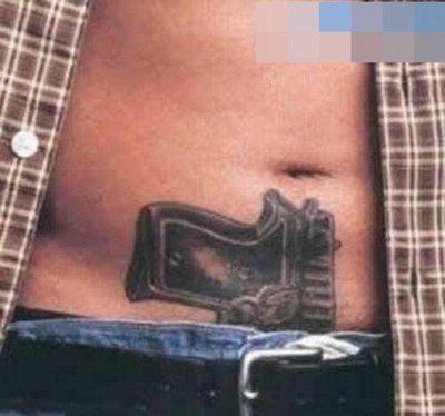 pistol tatoo on stomach