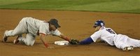 New York Mets' Carlos Beltran, right, beats the tag from St. Louis Cardinals second baseman Ronnie Belliard for a double during the first inning of Game 7 of baseball's National League Championship Series, Thursday, Oct. 19, 2006, at Shea Stadium in New York. (AP Photo/Winslow Townson) 