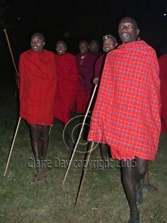 Masai Warriors loom from out of the darkness, Masai Mara, Kenya safari 