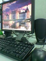 My new spiffy monitor, keyboards, and mouse for the office.