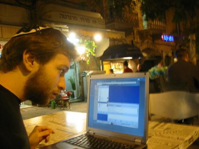 Daniel Shakhmundes goes on-line for free in Israel, using downtown Jerusalem's public wireless internet access
