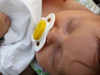 infant sleeping with dummies