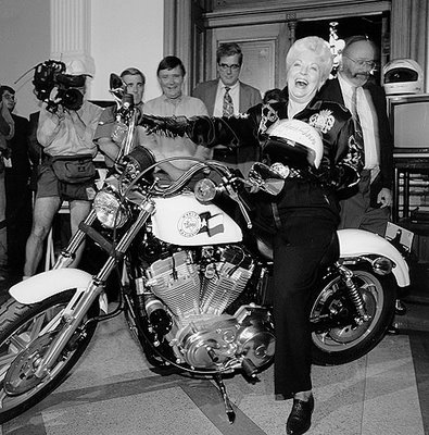 image:Ann Richards on bike from the Texas state library archive, b&w photo