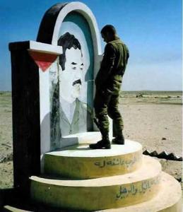 Guy peeing on Saddam - Funny Pic