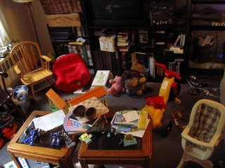 looking north: entertainment center, varied mess, fake coffee table