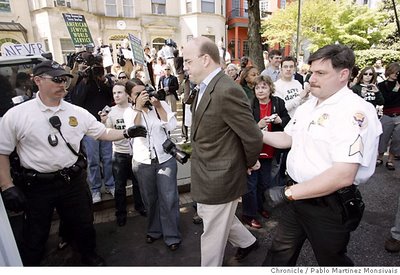 Rep. Jim McGovern, D-Mass., is escorted to a police vehicle by members of the Uniform Division of the Secret Service after his arrest during a demonstration outside the Sudanese Embassy in Washington. Associated Press photo by Pablo Martinez Monsivais