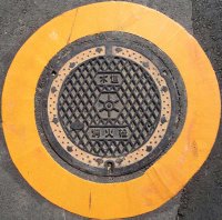 Fire extinguisher manhole cover in Minato ward, Tokyo.