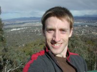 Me standing at the lookout atop Mount Ainsle with part of Canberra in and the surrounding region in the background.
